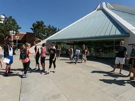 Students and staff talking after Chapel outside the CU Center